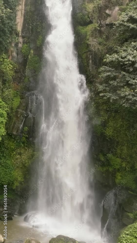 A tropical waterfall in a mountain canyon. Sikulikap Falls. Sumatra, Indonesia. A tropical waterfall in a mountain canyon. Sikulikap Falls. Sumatra, Indonesia.