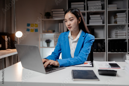 Business woman working in a startup company, female accountant working in auditing the company's accounts and finances, accounting and finance. Accounting and financial auditing concepts.