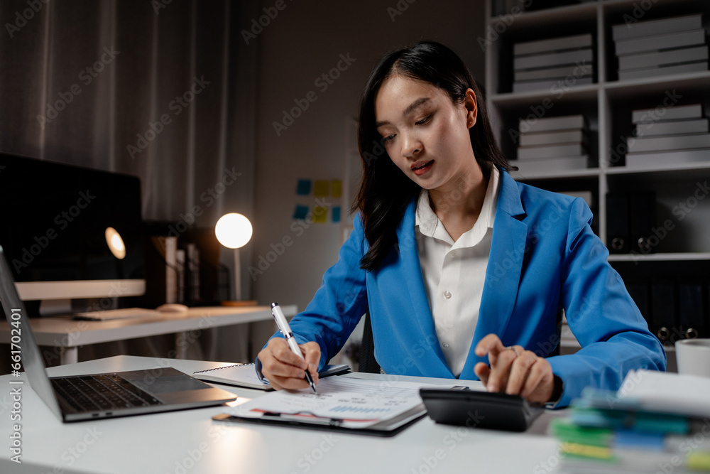 Business woman working in a startup company, female accountant working in auditing the company's accounts and finances, accounting and finance. Accounting and financial auditing concepts. Business woman working in a startup company, female accountant working in auditing the company's accounts and finances, accounting and finance. Accounting and financial auditing concepts.