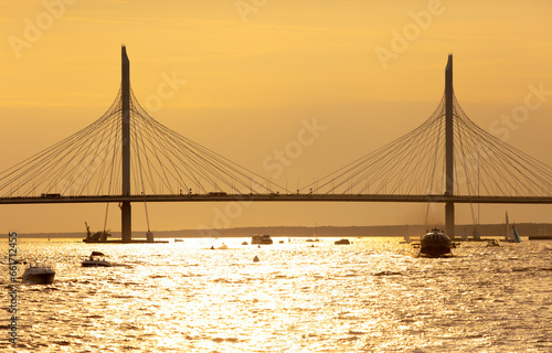 Bridge on the river at sunset