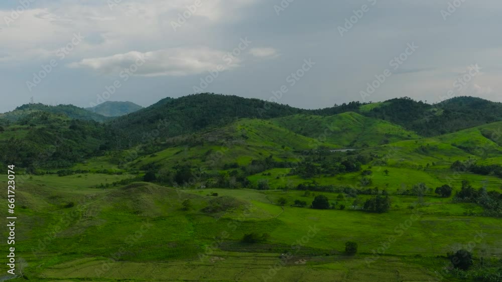 Tropical mountains with green forests and agricultural land with farm plantations. Mindanao, Philippines. Tropical mountains with green forests and agricultural land with farm plantations. Mindanao, Philippines.