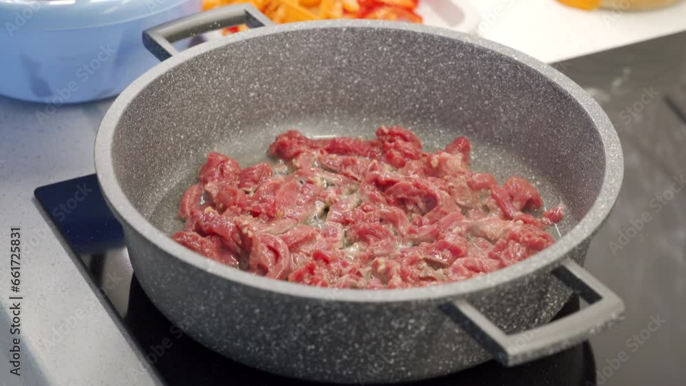 finely chopped beef meat fried in a frying pan finely chopped beef meat fried in a frying pan
