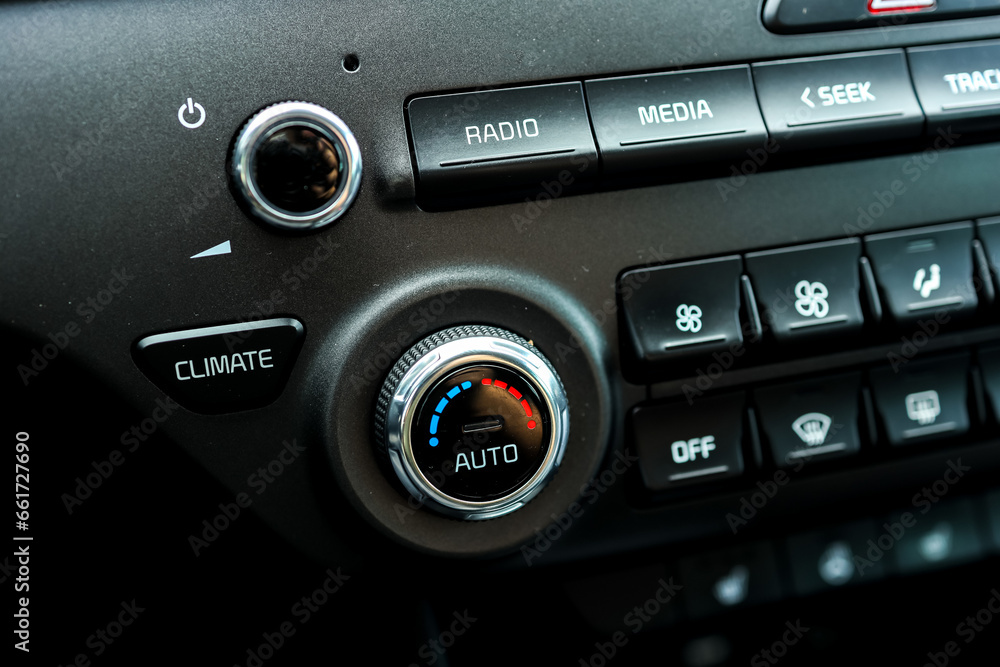 Modern car climate control panel for driver and passenger with shallow depth of field. Zone climate control. Car interior detail