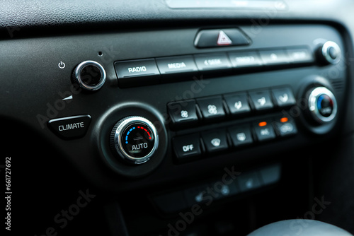 Modern car climate control panel for driver and passenger with shallow depth of field. Zone climate control. Car interior detail © shine.graphics