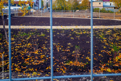 Wallpaper Mural School stadium behind a metal fence on an autumn day Torontodigital.ca