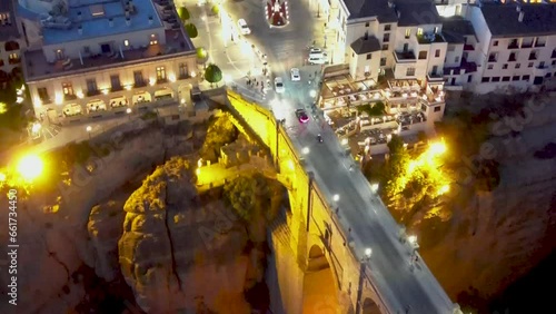 Aerial view of the Puente Nuevo Bridge and El Tajo Gorge with the cityscape of Ronda at night, Spain