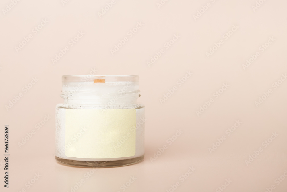 candle with blank label mock up on a beige background, aromatherapy, natural home decor, copy space candle with blank label mock up on a beige background, aromatherapy, natural home decor, copy space
