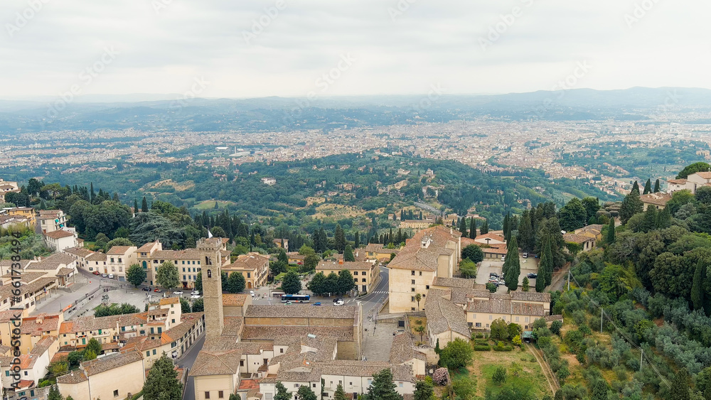 Florence, Italy. Fiesole is a city in the Tuscany region, in the province of Florence. The city of Florence in the background of the panorama, Aerial View