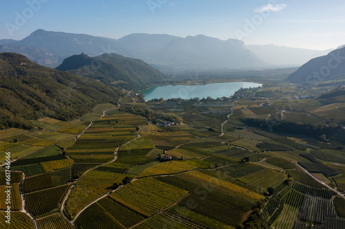 Die Weinfelder in Kaltern und der Kalterer See im Herbst aus der Luft. Südtirol 3 photo