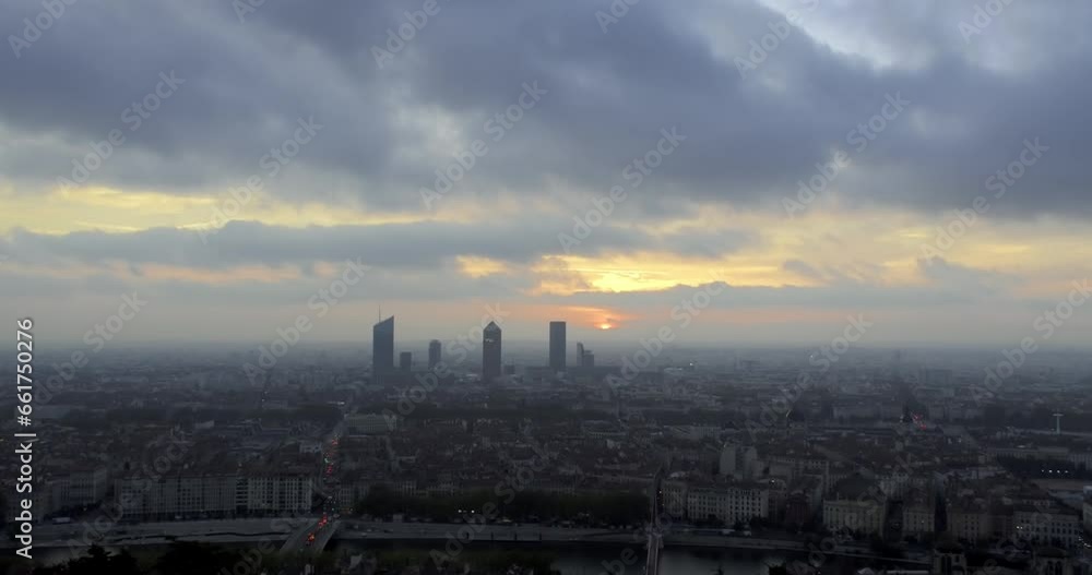 Timelapse of sunrise above Lyon skyline on a cloudy and foggy morning, accelerated 3 times, France Timelapse of sunrise above Lyon skyline on a cloudy and foggy morning, accelerated 3 times, France