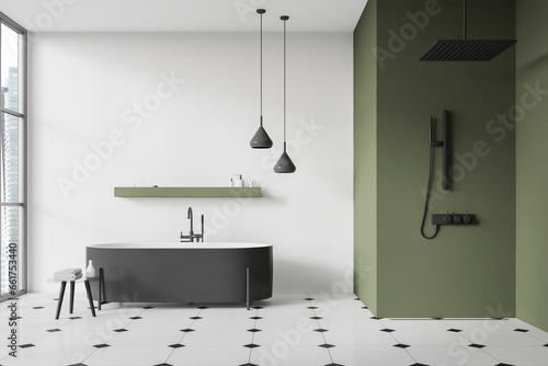 Green and white bathroom with tub and shower