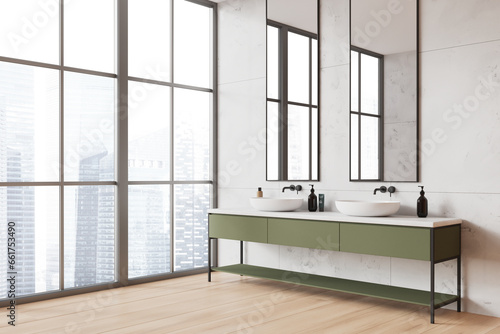 Stylish home bathroom interior with double sink and dresser near window