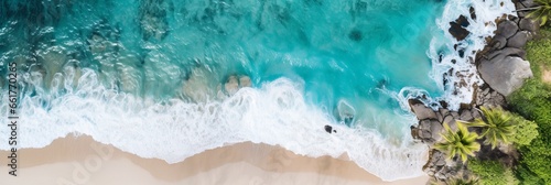 overhead photo of a desert island beach in the middle of the ocean 