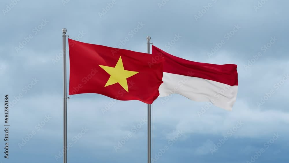 Indonesia flag and Vietnam flag waving together on cloudy sky, endless seamless loop, two country relations concept Indonesia flag and Vietnam flag waving together on cloudy sky, endless seamless loop, two country relations concept