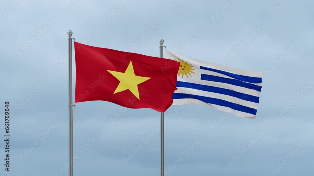 Uruguay and Vietnam flag waving together on cloudy sky, endless seamless loop, two country cooperation concept Uruguay and Vietnam flag waving together on cloudy sky, endless seamless loop, two country cooperation concept