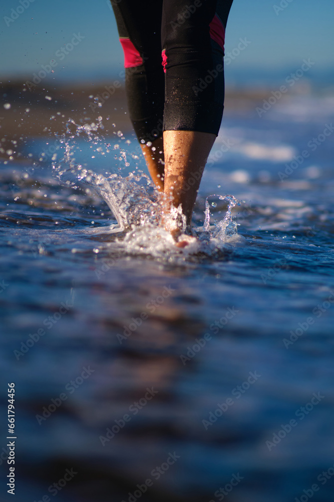 women's feet walking on water