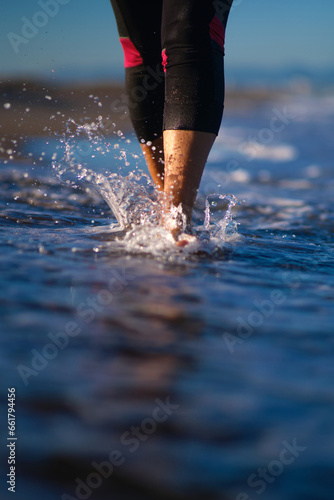 women's feet walking on water