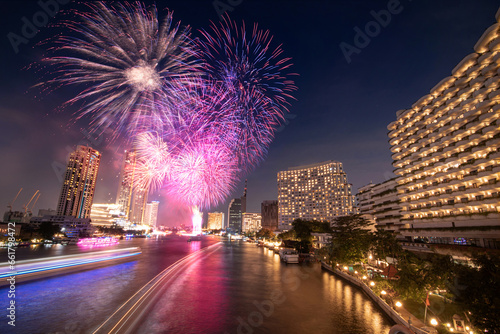 Firework celebrating New Year's Day on the Chao Phraya River, Bangkok, Thailand. © paitoon