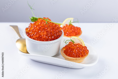 red caviar on a white plate. snack in canapes