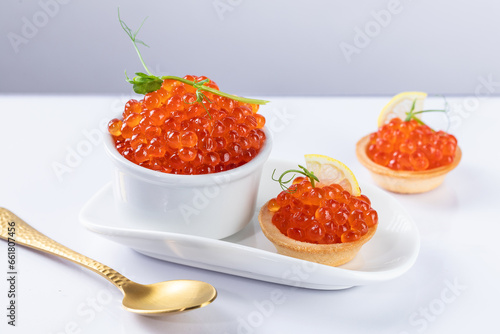 red caviar on a white plate. snack in canapes