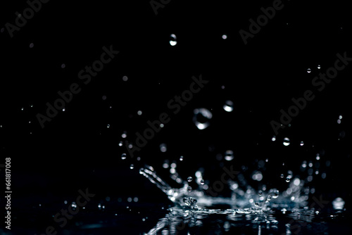 rain background. water droplets, splashes on a black background