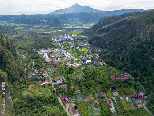 Aerial view of Harau Valley, a popular tourist spot featuring mountains and rice fields at Sumatra island, Indonesia.