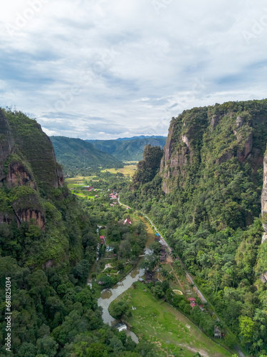 Aerial view of Harau Valley  a popular tourist spot featuring mountains and rice fields at Sumatra island  Indonesia.