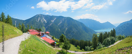 hiking route to Feilkopf mountain with view to alpine guest house and lake Achensee