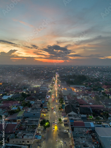 Aerial view of Pekanbaru city skyline during sunset. Capital city of Riau province in Indonesia.