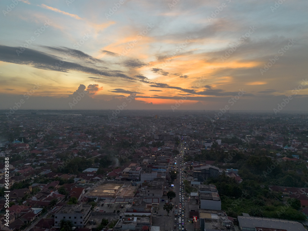 Aerial view of Pekanbaru city skyline during sunset. Capital city of Riau province in Indonesia.