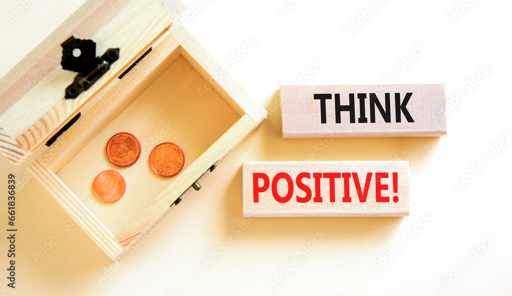 Think positive symbol. Concept words Think positive on beautiful wooden block. Beautiful white table background. Wooden chest coins. Business, motivational think positive thinking concept. Copy space. Think positive symbol. Concept words Think positive on beautiful wooden block. Beautiful white table background. Wooden chest coins. Business, motivational think positive thinking concept. Copy space.