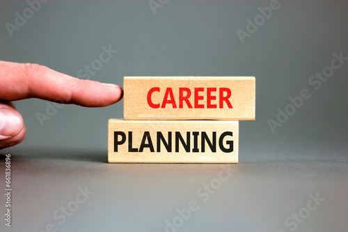 Career planning symbol. Concept words Career planning on beautiful wooden block. Beautiful grey table grey background. Businessman hand. Business, motivational career planning concept. Copy space.