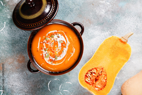 Traditional autumn butternut squash soup with seeds.