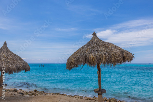 Beautiful view of sun beds on sandy beach Caribbean sea. Aruba.