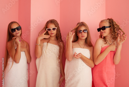 four girls in towels and sunglasses