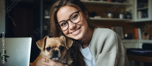 young adult woman working at home stay cuddle hand pet animal dog best friend in living room at home stay home with pet lifestyle concept