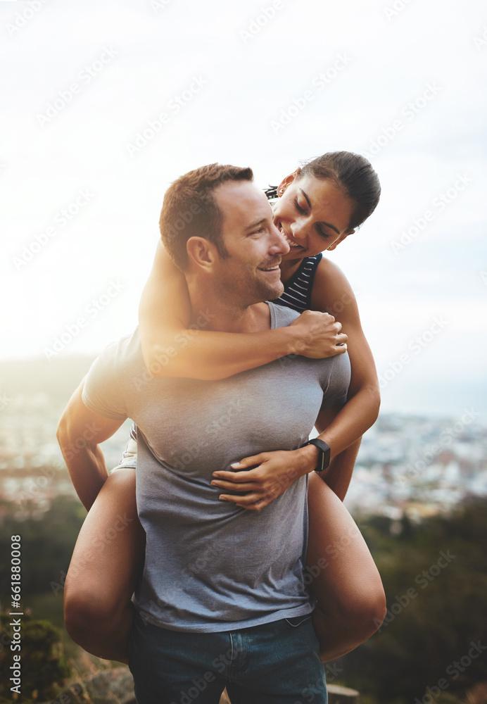 Love, piggyback or happy couple hiking in nature on outdoor date for care with support, loyalty or trust. Romantic man, wellness or woman on holiday vacation together to relax or smile in park