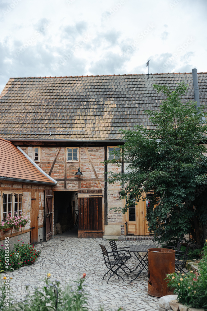 Old brick farm building in Germany on a cloudy day Old brick farm building in Germany on a cloudy day