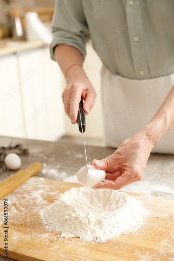 Young man kneading dough on wooden table. Males hands making bread on the kitchen. Baking concept. Young man kneading dough on wooden table. Males hands making bread on the kitchen. Baking concept.