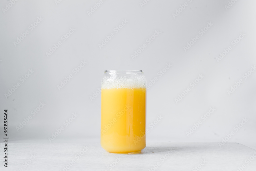 Orange juice in a can shaped glass, orange juice in a glass shaped like a can, Aesthetic cafe drink in a can glass Orange juice in a can shaped glass, orange juice in a glass shaped like a can, Aesthetic cafe drink in a can glass