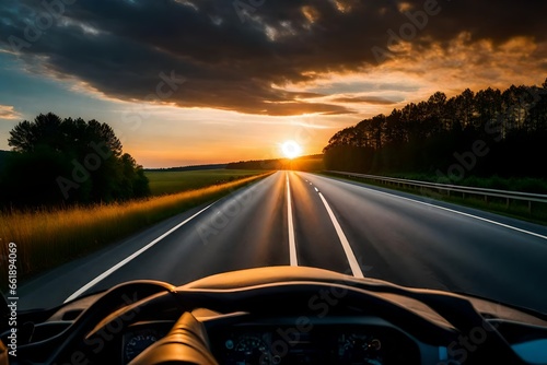 car driving on a highway at sunset