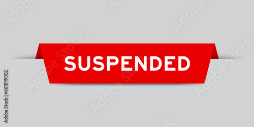 Red color inserted label with word suspended on gray background