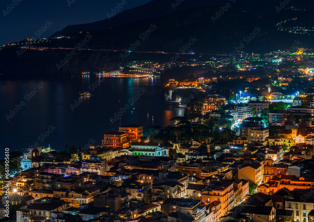 Panoramic view of Sorrento and Mount Vesuvius across the Bay of Naples in Italy at night
