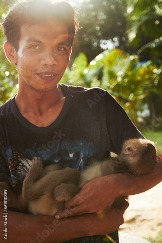 Photography Zoo, nature and portrait of man with monkey for care, conservation and wildlife rescue
