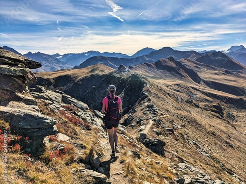 Hiking on the mountain ridge from Jakobshorn towards Tällihorn in the Davos Klosters Mountains. Breathtaking view of the Sertig and Dischma valley. High quality photo photo