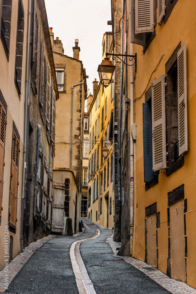 Clermont Ferrand, France - January 9 2023 - Narrow street in the medeival city of Clermont Ferrand