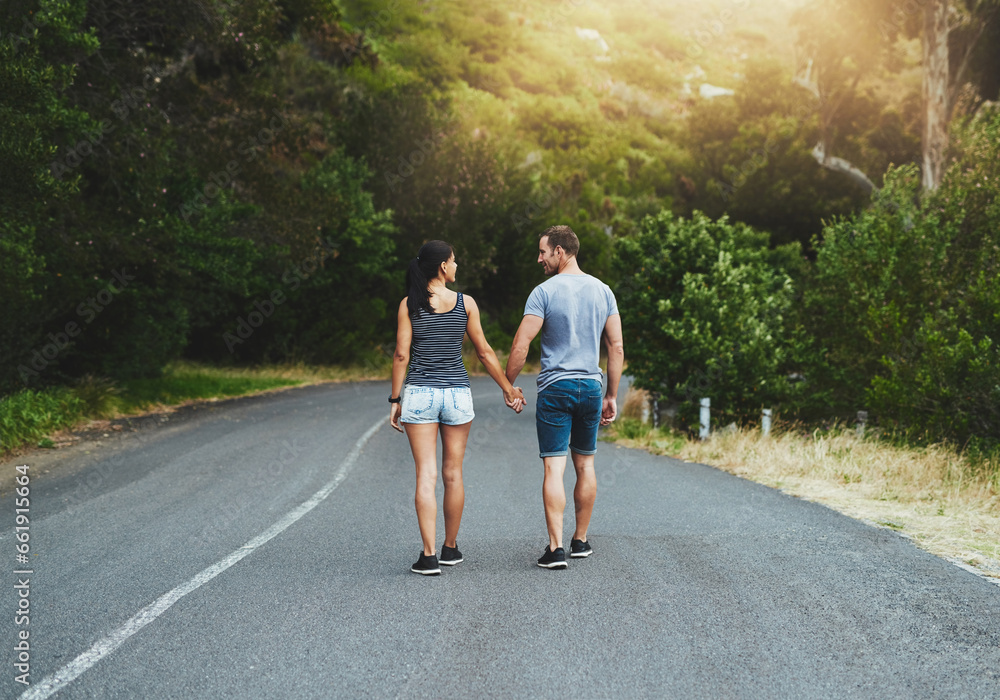 Road, travel or couple holding hands or walking on date with trust, care for romance, hiking or adventure. Loyalty, love or man with woman on holiday vacation together for bond, support or wellness Road, travel or couple holding hands or walking on date with trust, care for romance, hiking or adventure. Loyalty, love or man with woman on holiday vacation together for bond, support or wellness