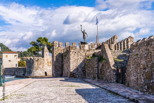 Nafpaktos, Greece - 4 february 2023 - The old city at the waterfront of the old venetian town with the statue of Miguel de Cervantes Monument photo