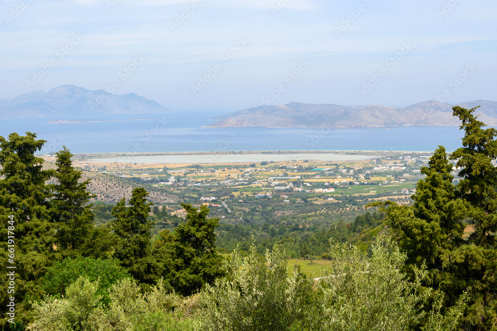 View of the island of Kos from above. Salt lake and sea in the background