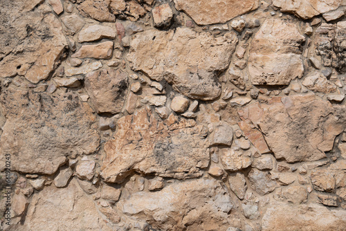Texture of an ancient stone wall on archaeological excavations in Hebron city